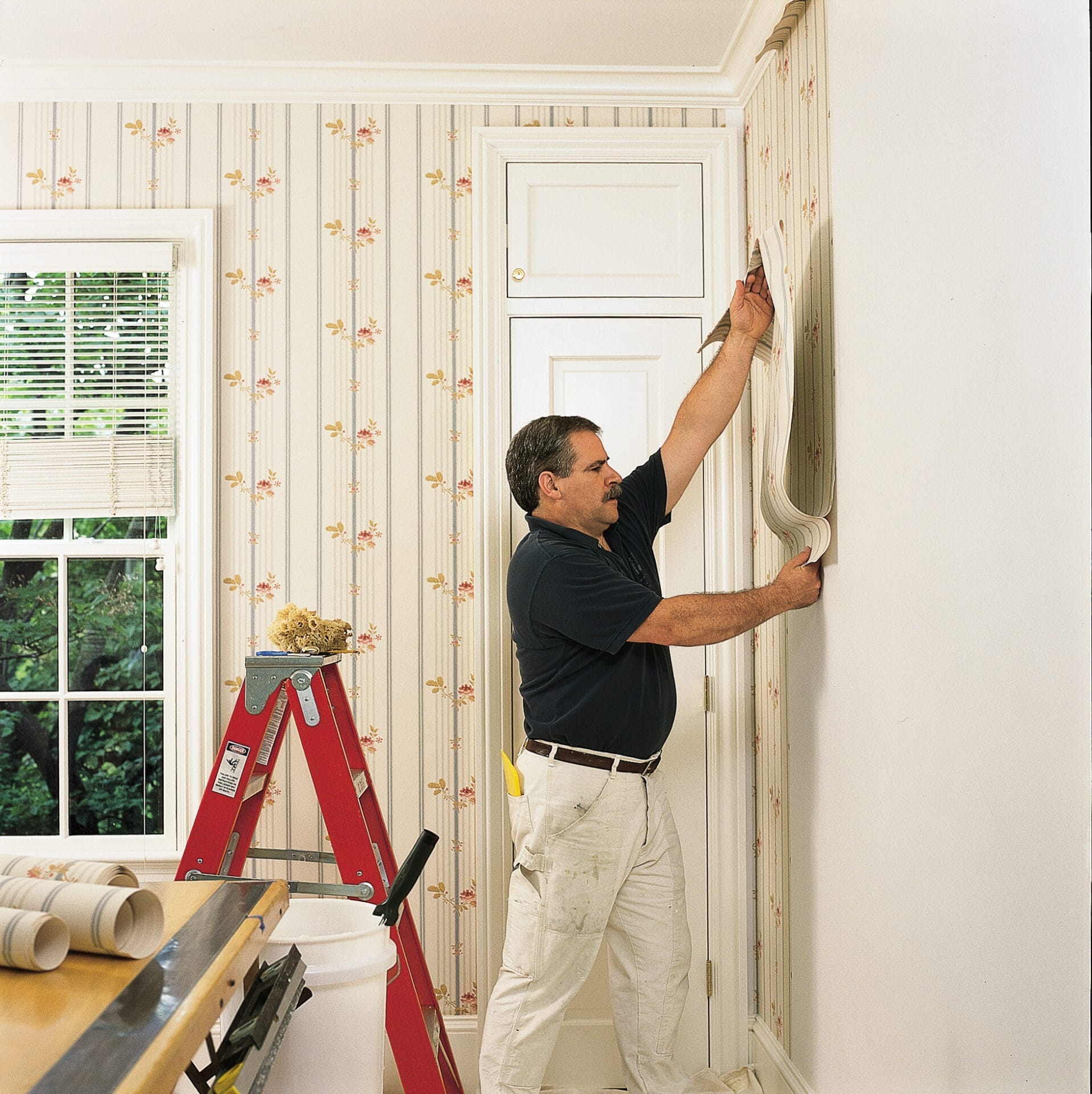 Wallpaper installation in progress inside a residential interior
